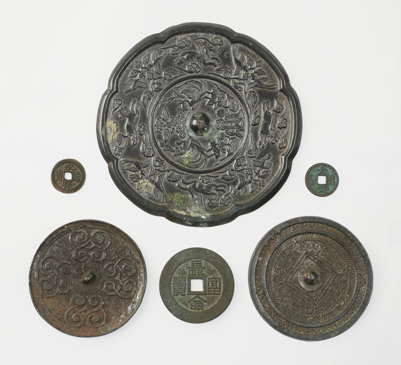 Appraisal: PC CHINESE MIRRORS AND COINS Comprising - old Chinese metal