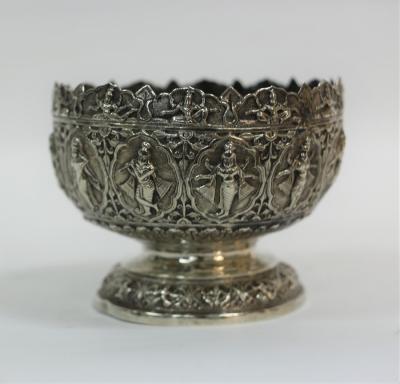 Appraisal: An Indian white metal bowl with crowned border depicting a