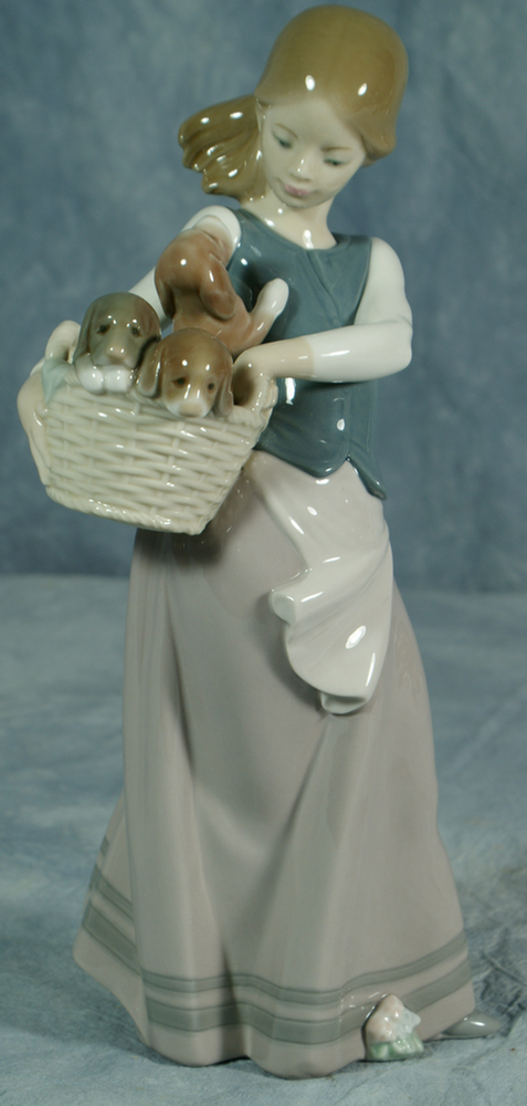 Appraisal: Lladro figurine girl with basket of puppies tall no damage