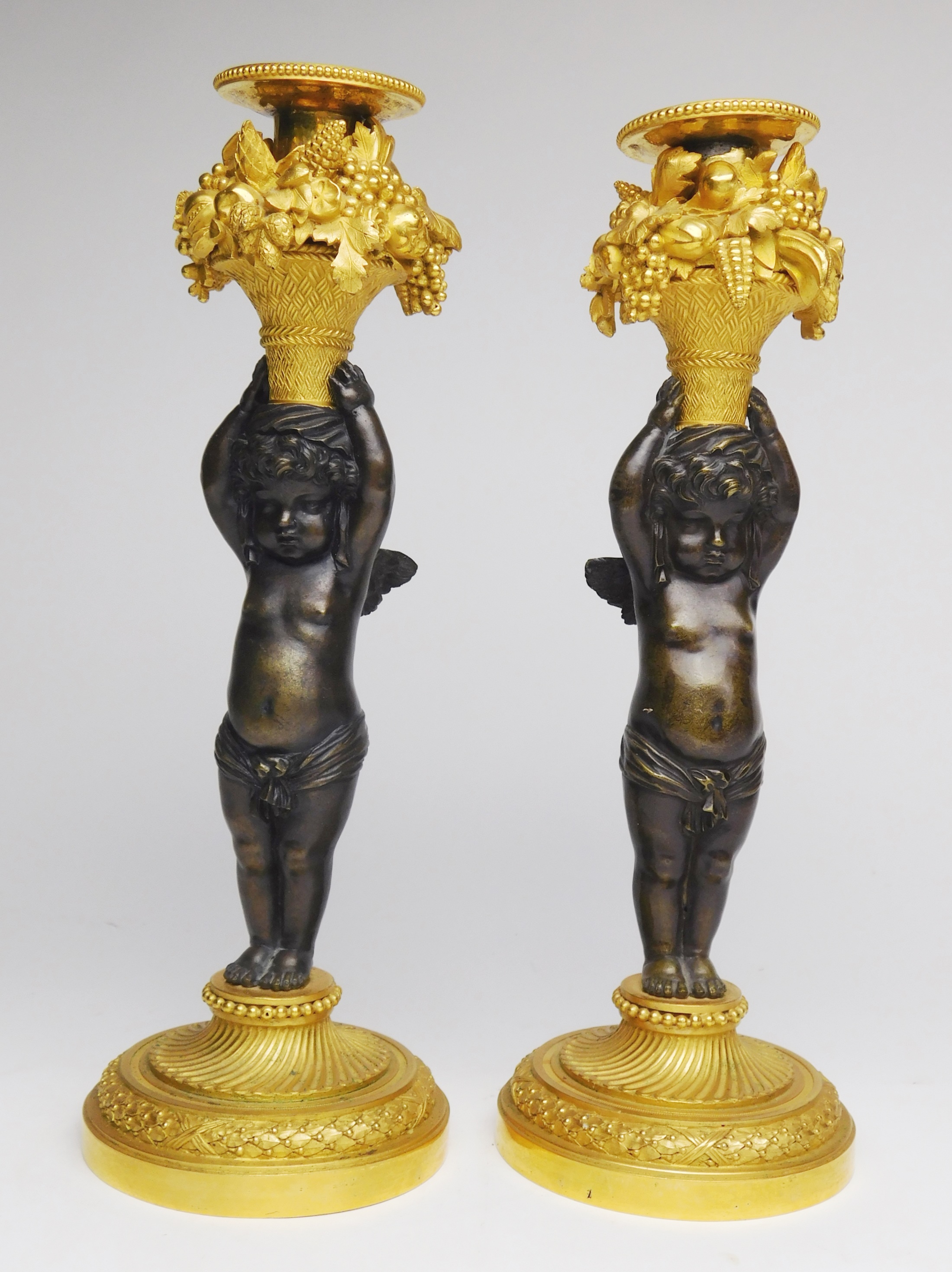 Appraisal: Pair of th c French bronze and gilt bronze candlesticks