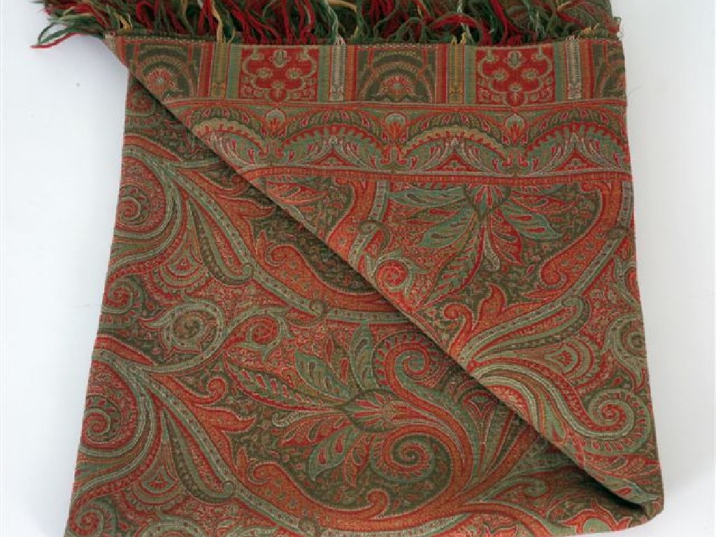 Appraisal: WOVEN WOOL PAISLEY SHAWL with a red ground by cm