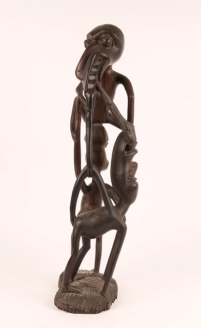 Appraisal: AN EAST AFRICAN SHETANI STYLE MAKONDE WOOD CARVED MYTHOLOGICAL GROUP