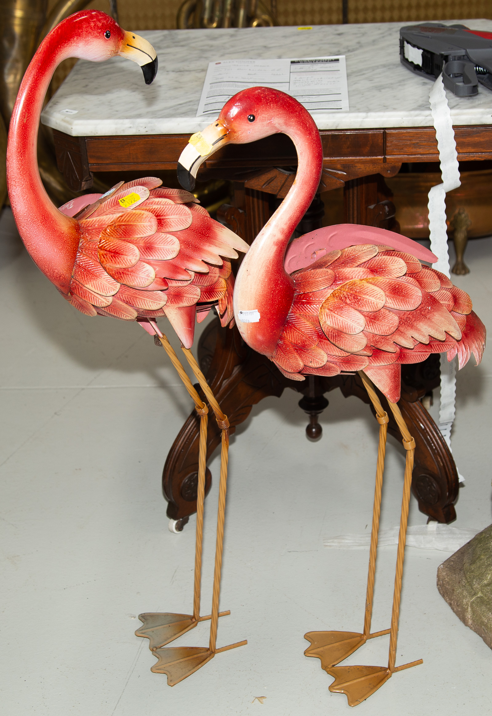 Appraisal: A PAIR OF TIN PINK FLAMINGOES to in H