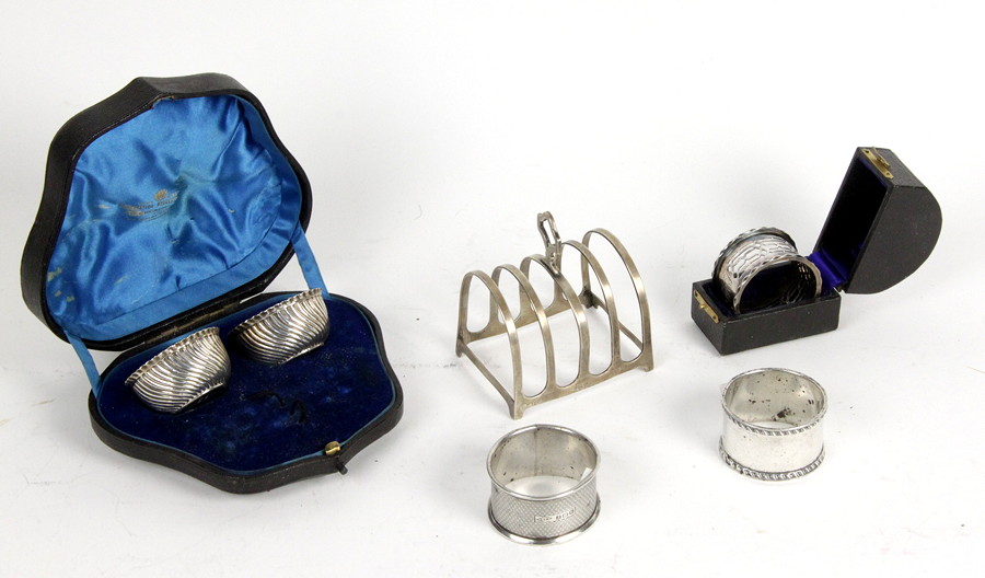 Appraisal: A silver five-bar toast rack Birmingham cm wide three silver