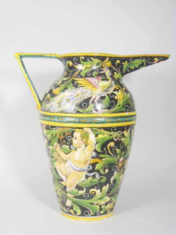 Appraisal: A large Italian maiolica Ewer painted peacocks and cherubs in