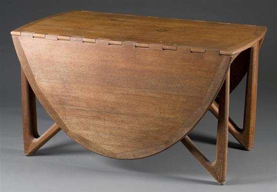 Appraisal: Hans Wegner style Danish modern oval drop leaf table nd