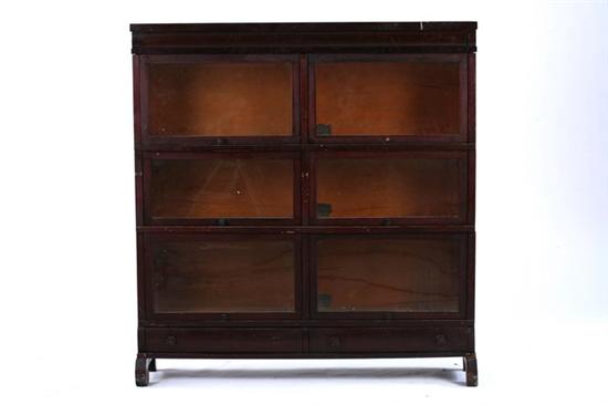 Appraisal: BARRISTER MAHOGANY BOOK CASE Early th century Plinth crown curving