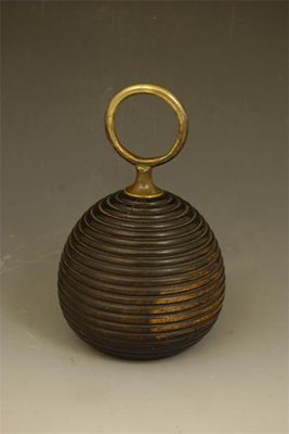 Appraisal: A Regency turned lignum vitae door stop of ribbed conical