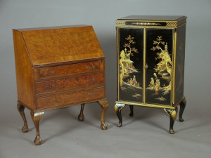 Appraisal: A Chinoiserie and black lacquered two door record cabinet late