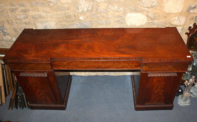 Appraisal: AN EARLY VICTORIAN MAHOGANY PEDESTAL SIDEBOARD with one long and