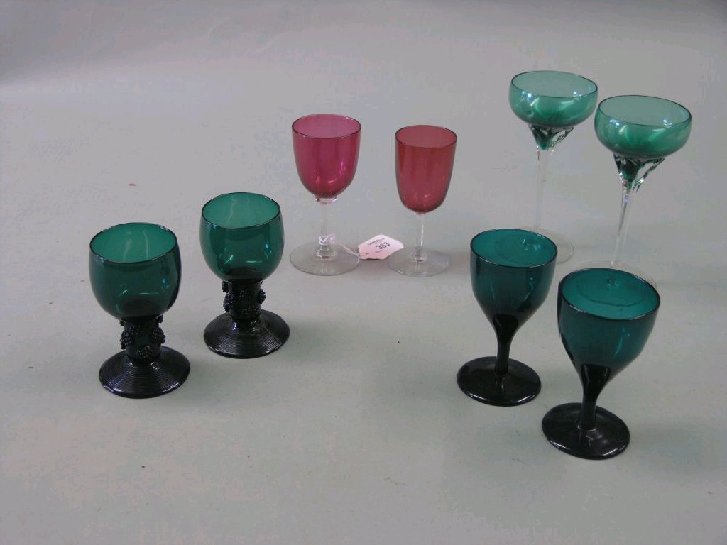 Appraisal: A pair of early th century emerald-green wine glasses eight