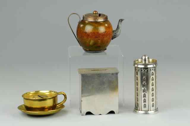 Appraisal: ASSORTED FIGURAL STILL BANKS Varied mediums includes brass tea cup