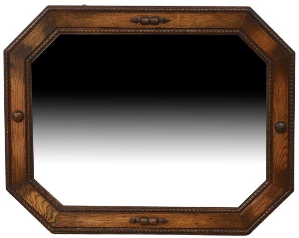 Appraisal: English Edwardian style oak wall mirror mid th c octagonal