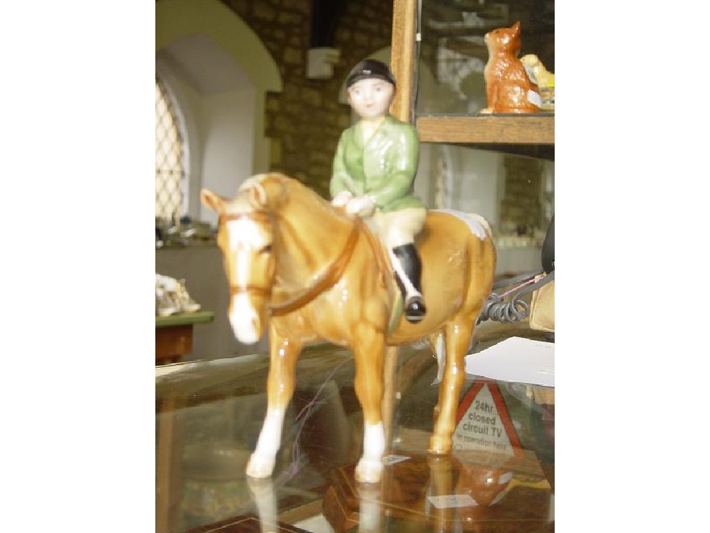 Appraisal: A Beswick model of a boy wearing a green jacket