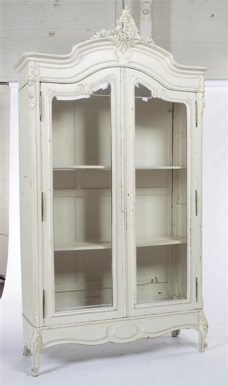 Appraisal: An early th century white painted armoire the carved arched