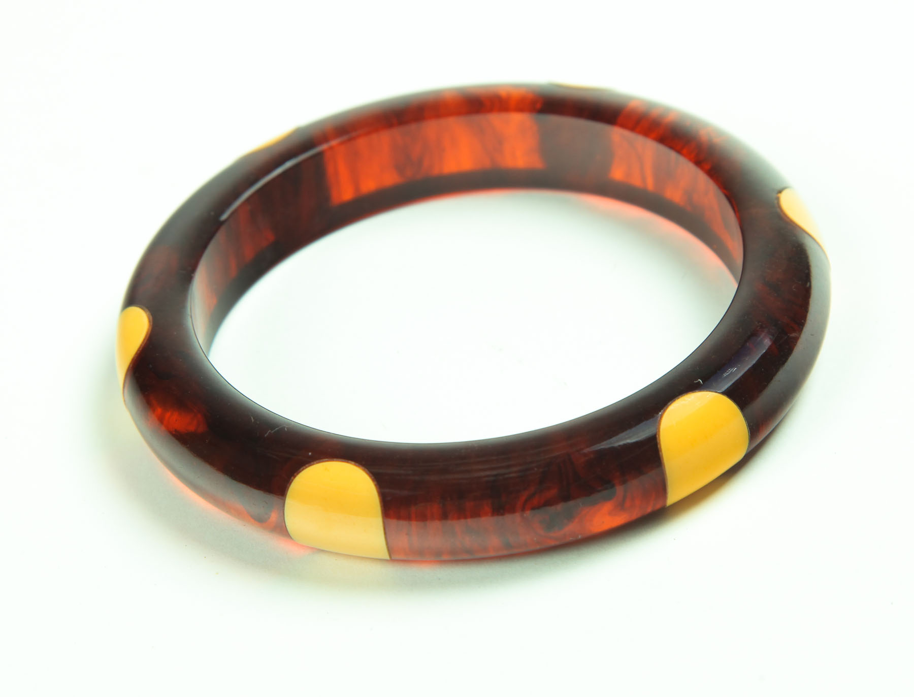 Appraisal: BAKELITE BRACELET American st half- th century Rootbeer bakelite with