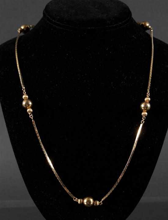 Appraisal: Lady's K yellow gold beaded flexible chain necklace grams Estimate