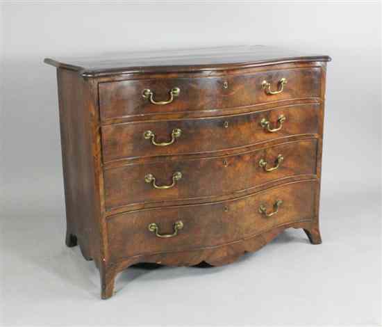 Appraisal: A George III serpentine mahogany chest of four graduated long