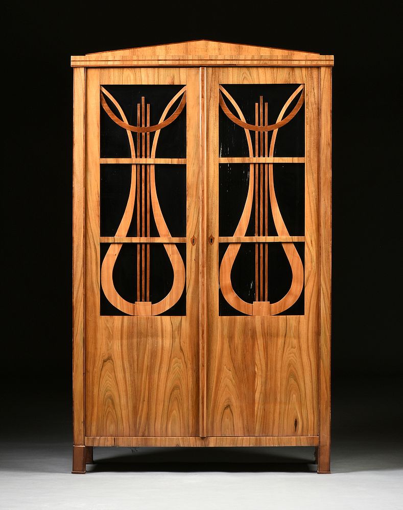 Appraisal: A BIEDERMEIER WALNUT AND CHERRY GLAZED SALON DISPLAY CABINET FIRST