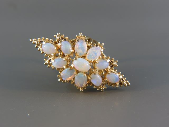 Appraisal: Opal Ring oval fiery gems totaling carats in k yellow