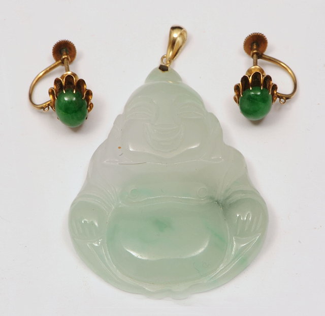 Appraisal: A CHINESE JADE PENDANT in the form of a buddha