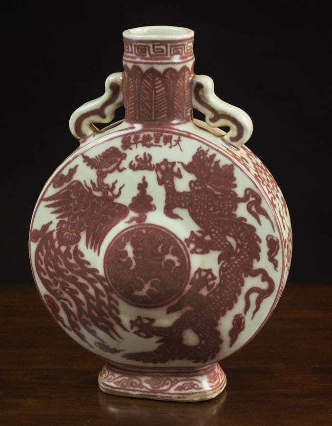 Appraisal: CHINESE MING STYLE PORCELAIN MOON FLASK with iron red dragon