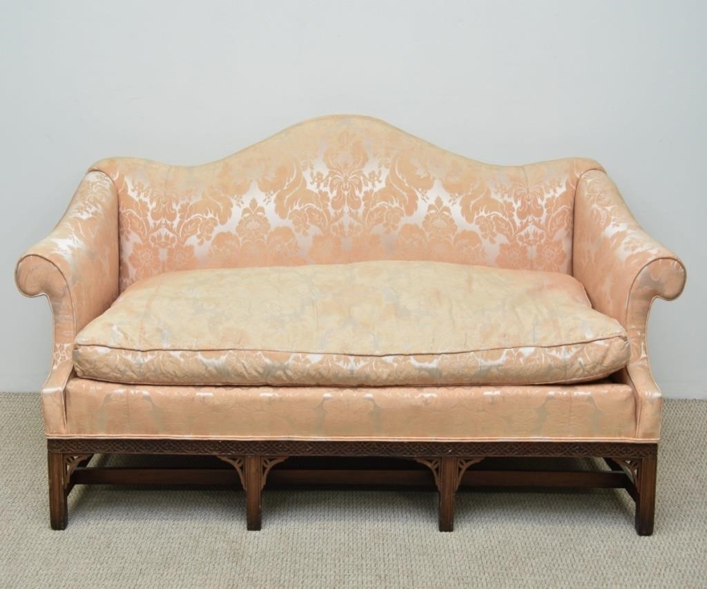 Appraisal: Chippendale style mahogany camelback sofa with blind fretwork h x