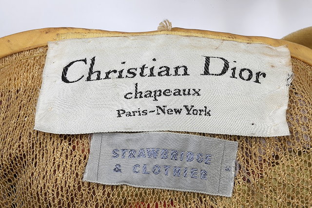 Appraisal: A Christian Dior hat with ribbon detail in orange yellow