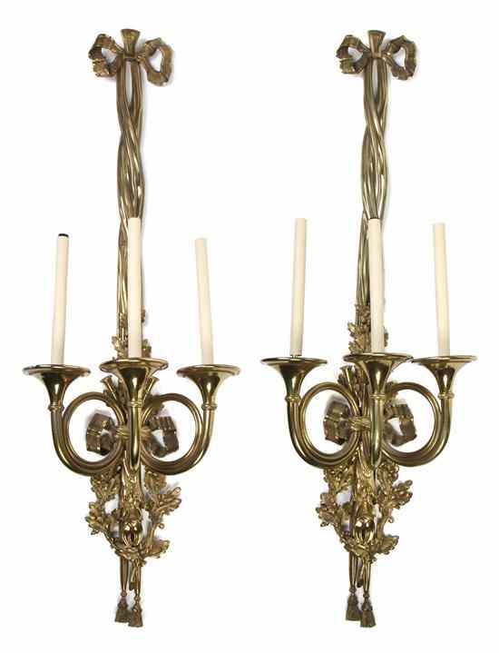 Appraisal: A Pair of Gilt Bronze Three-Light Sconces each having a