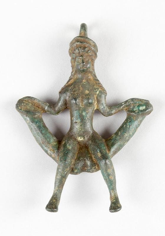 Appraisal: Erotic bronze amulet Erotic bronze amulet in Ancient manner shwoing