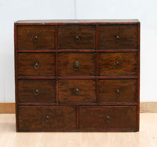 Appraisal: A set of Victorian pine spice drawers with brass ring