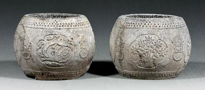 Appraisal: Two Chinese gray stone urns globular with carved design of