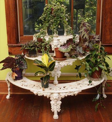 Appraisal: VICTORIAN WHITE-PAINTED CAST-IRON FOUR-TIER PLANT STAND Each graduated semi-circular pierced