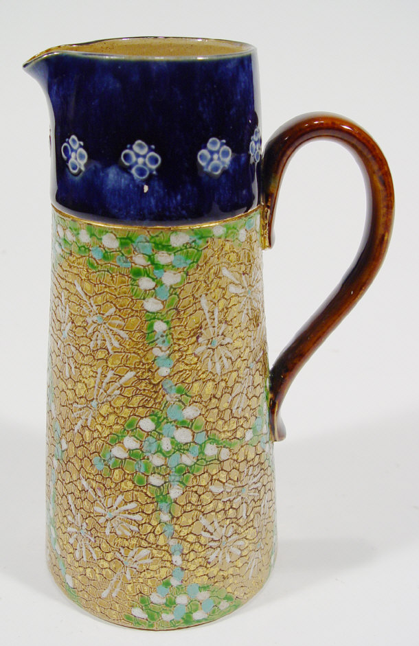 Appraisal: Royal Doulton stoneware jug of tapering form with enamelled and