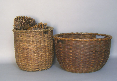 Appraisal: Two splint oak gathering baskets th c h dia and