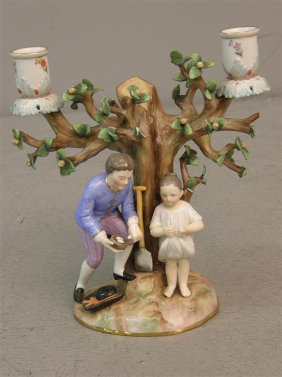 Appraisal: Continental porcelain candelabrum the base with man and young girl