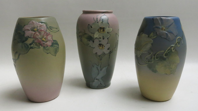 Appraisal: THREE WELLER ART POTTERY VASES having matte glazed floral patterns