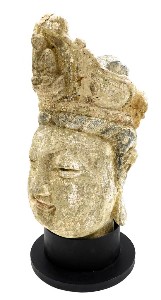 Appraisal: ASIAN Early carved earthen architectural element depicting the head of