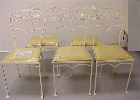 Appraisal: Five cream-colored wrought iron patio chairs with detachable cushions upholstered