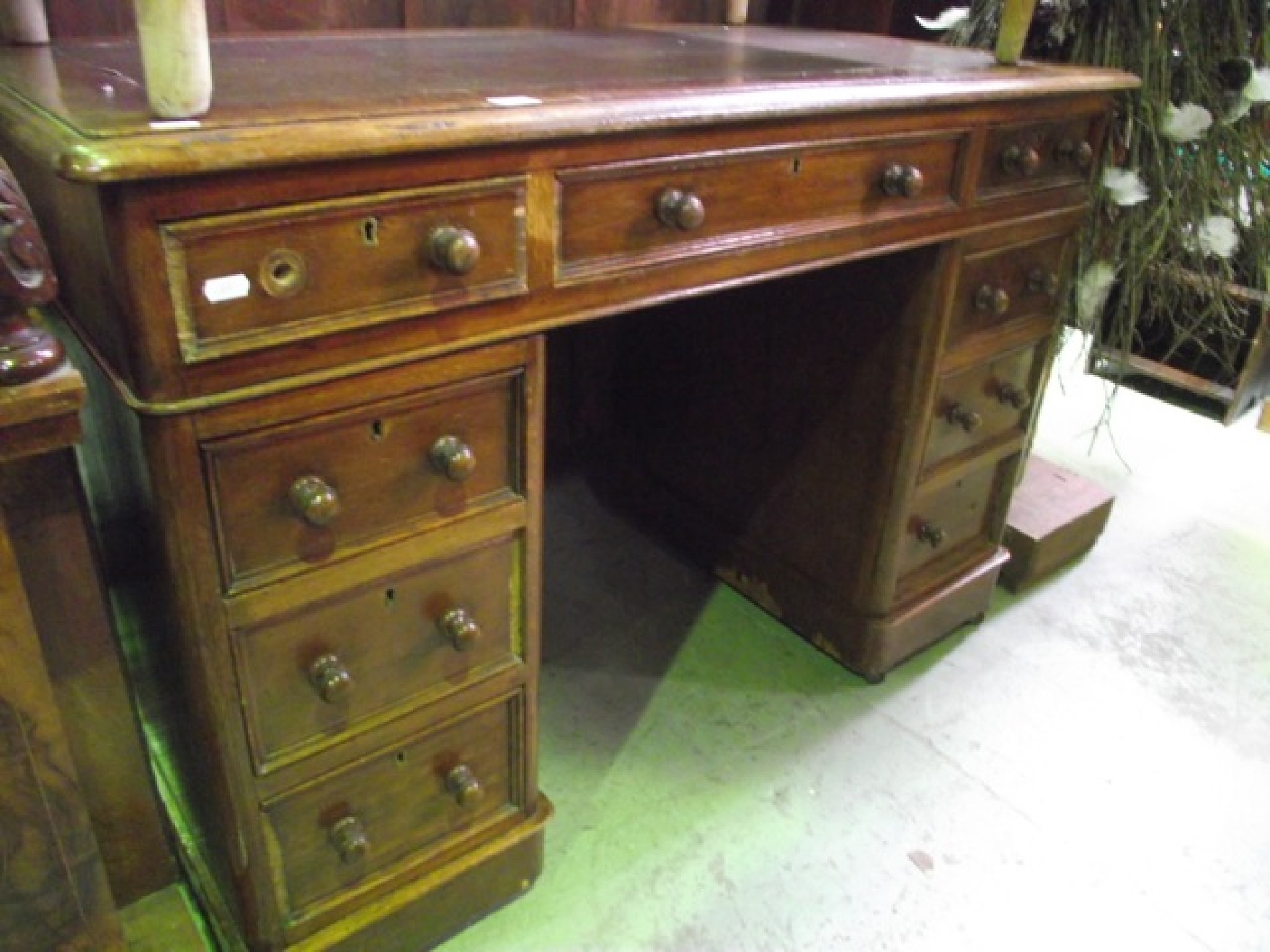 Appraisal: A Victorian oak kneehole twin pedestal desk with inset faux