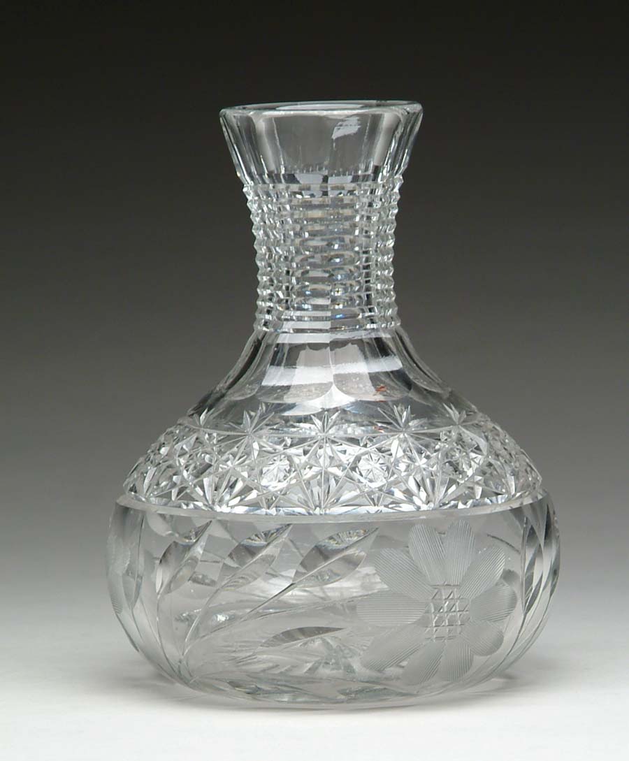 Appraisal: CUT GLASS WATER CARAFE Carafe with a floral and hobstar