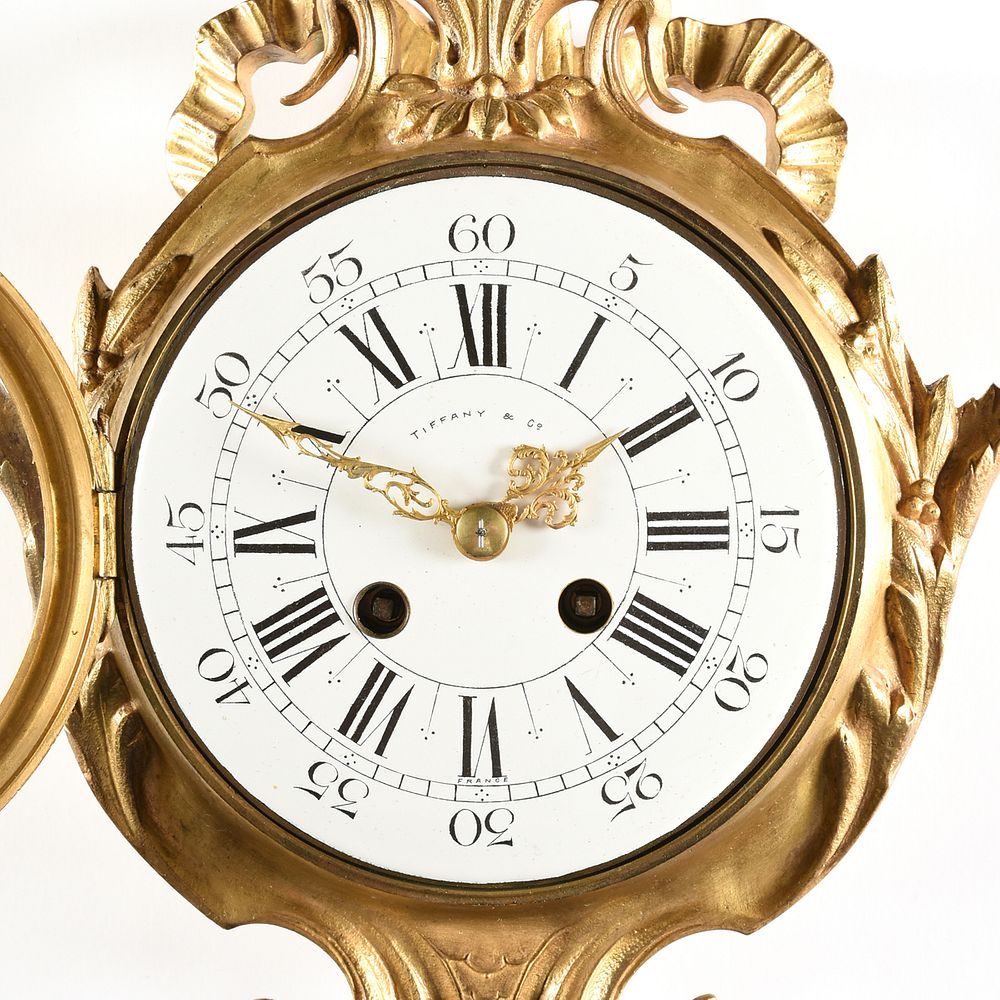 Appraisal: A TIFFANY CO NEOCLASSICAL STYLE ORMOLU CARTEL CLOCK SIGNED EARLY