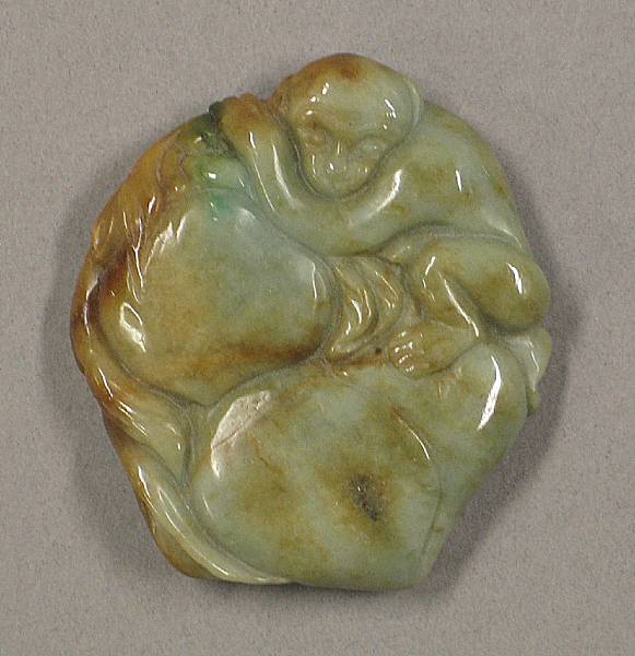 Appraisal: A mottled green jadeite pendant Carved in the form of