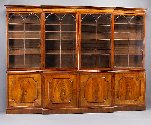 Appraisal: A George III mahogany breakfront cabinet circa The stepped cornice