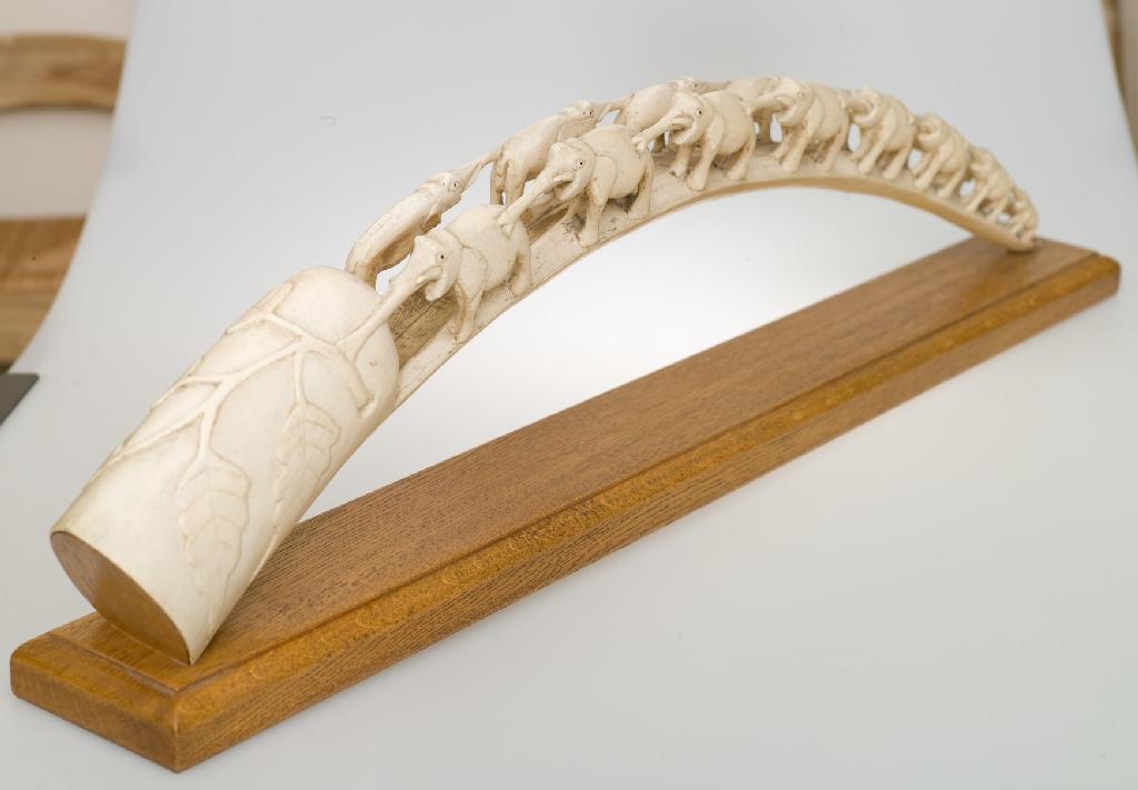 Appraisal: CEYLONESE IVORY TUSK c carved as a double procession of