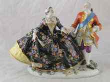 Appraisal: A ceramic group of a lady and gentleman in th