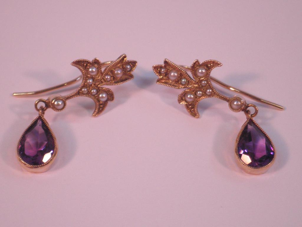 Appraisal: A pair of amethyst and seed pearl earrings set in