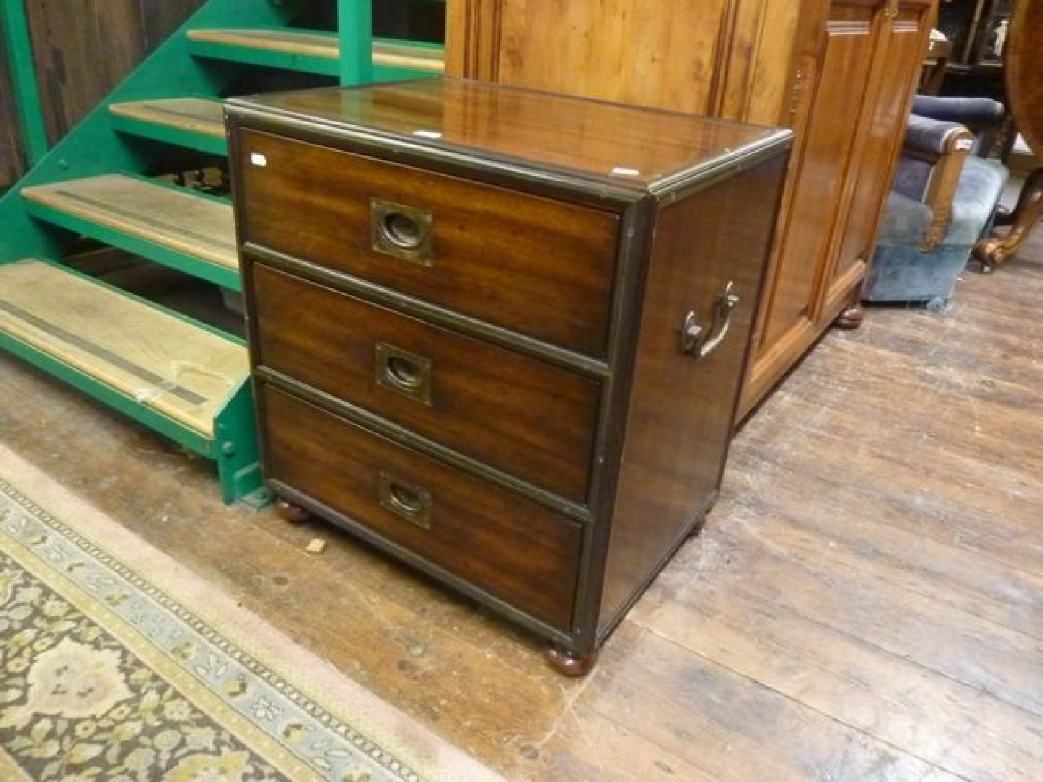 Appraisal: A contemporary chest of three short drawers in a military