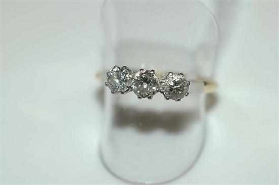 Appraisal: A THREE STONE DIAMOND RING STAMPED CT GOLD AND PLATINUM