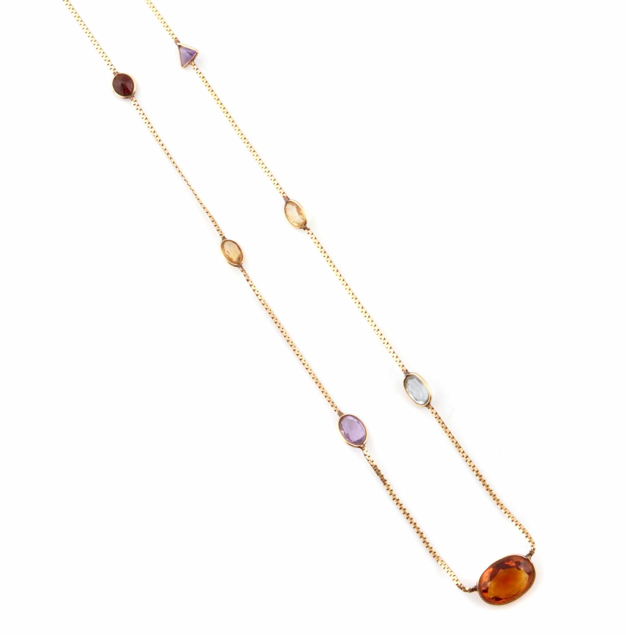 Appraisal: A gem-set and k gold chain necklace length approximately in